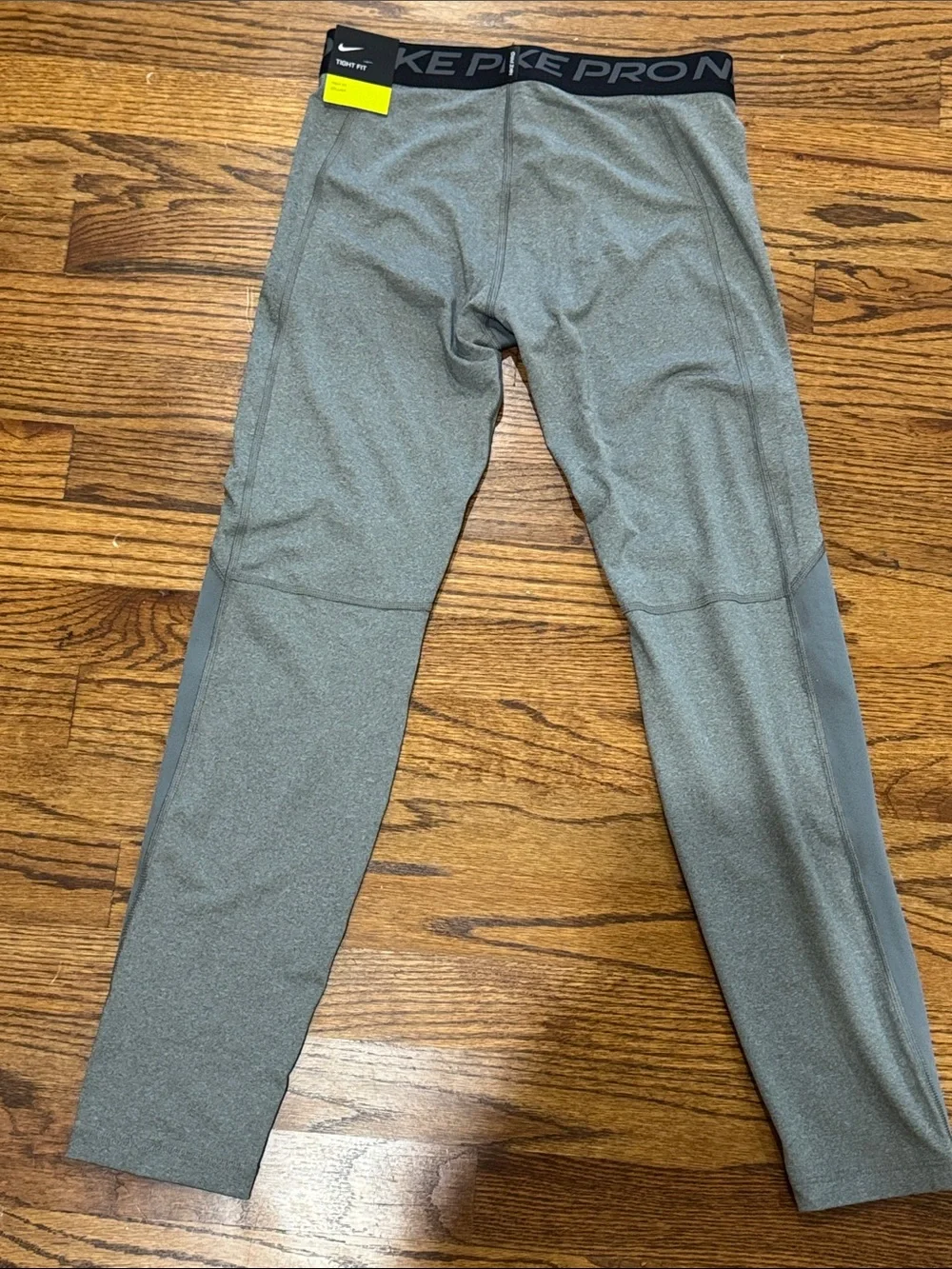 Nike Kids Grey Athletic Compression Leggings with White Swoosh sz: kids Large